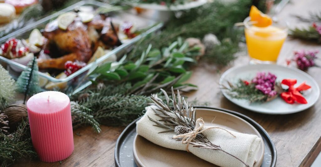 High angle of table served for Christmas dinner with plates with napkins and traditional roasted turkey on glass dish decorated with fir twigs